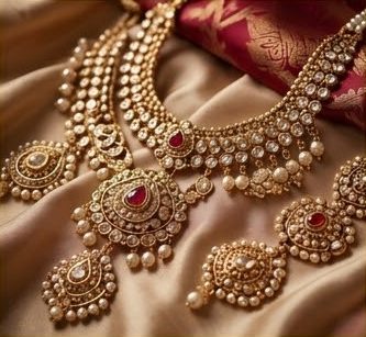 Gold and pearl bridal jewellery laid on silk